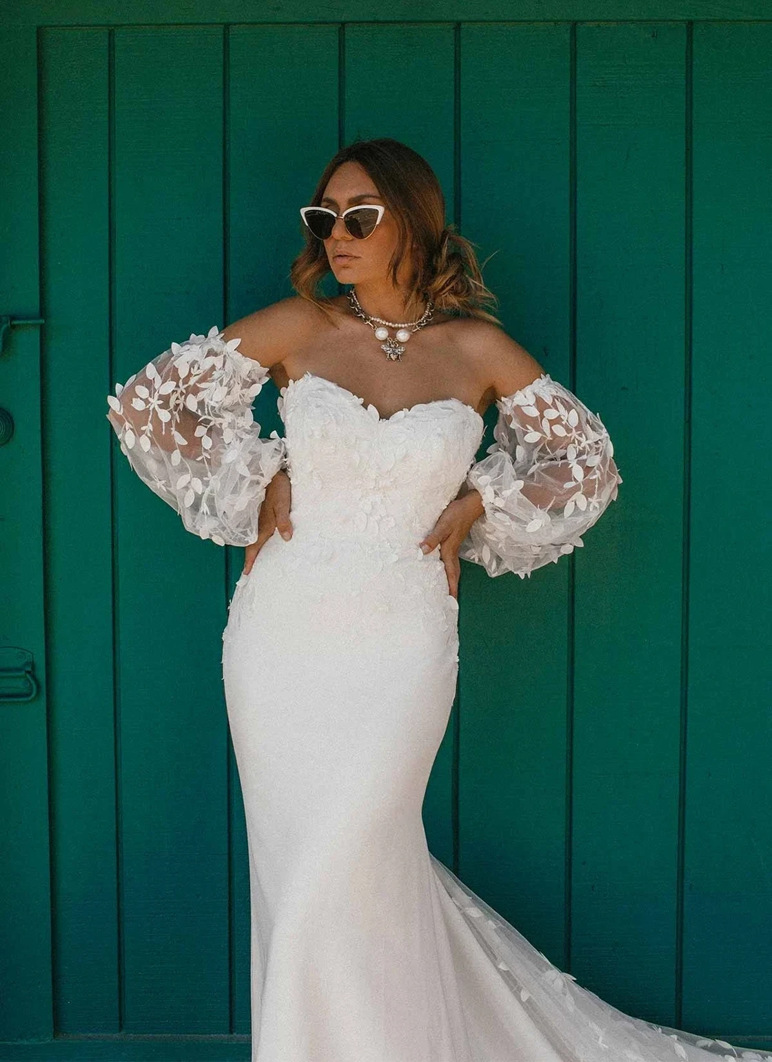 Photo of the model wearing a bridal gown.